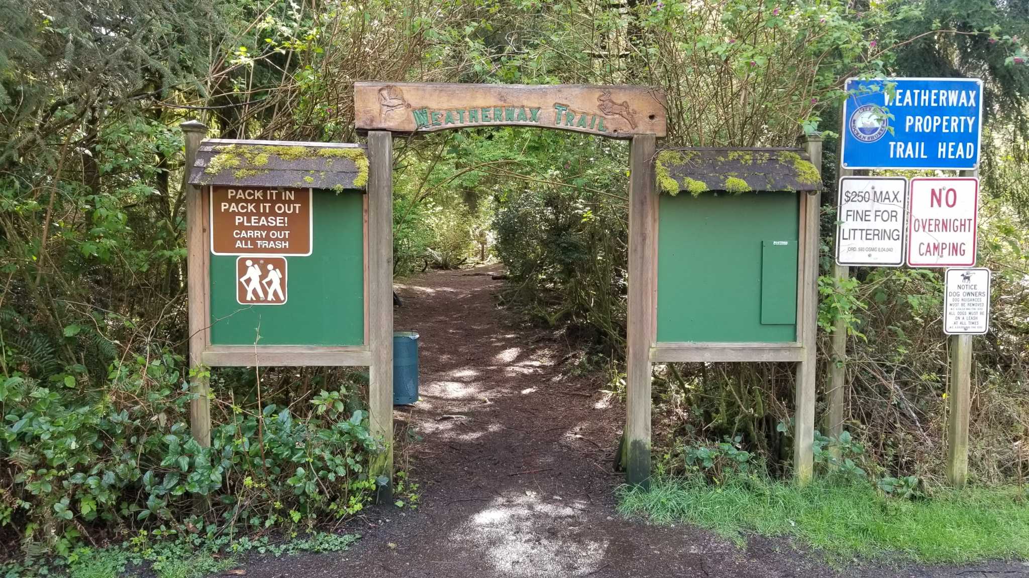 Trailhead arch with signage (pack it in and pack it out, littering and overnight camping notice) at Weatherwax Trail. Photo by ShellTheExplorer.
