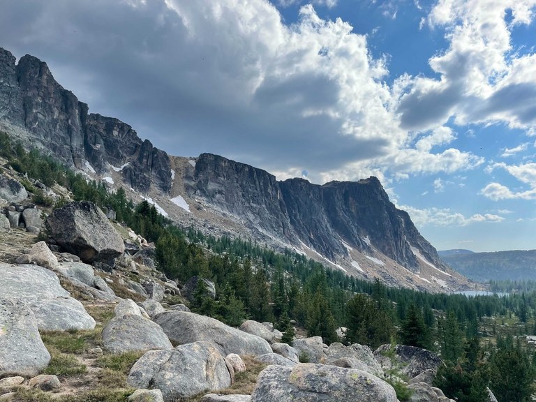 Cathedral Pass Loop. Photo by Rachel Wendling. A boulder field with a large rocky outcropping in the distance.