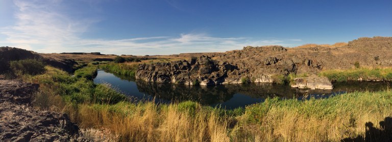 Escure Ranch Photo of a river in a landscape of grasses and rock