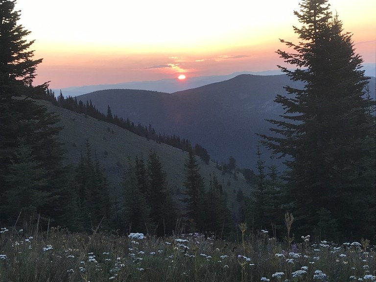 Kettle Crest Trail sunset. Photo by Renegade Beef. Sun setting behind a ridge of mountains.