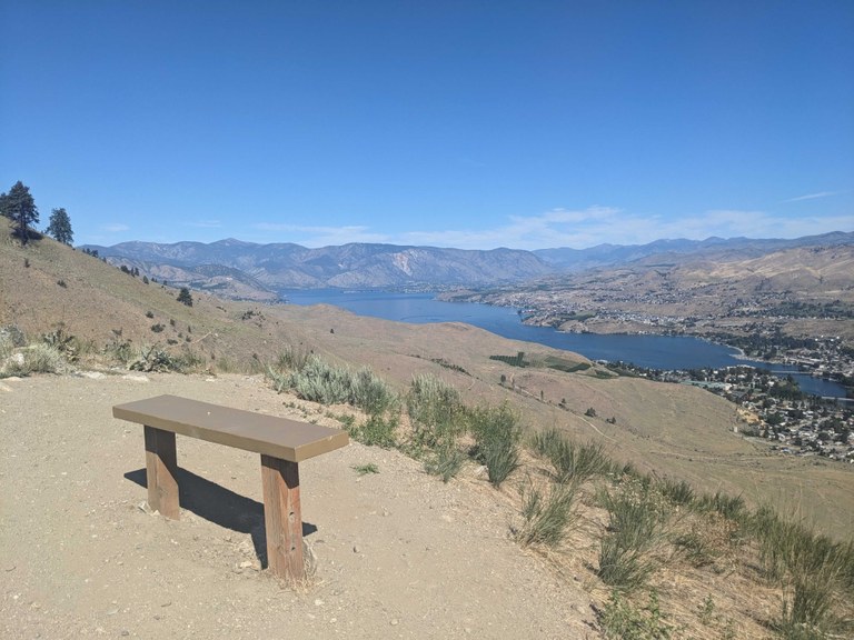 Chelan Butte Photo of a viewpoint with bench in the foreground and a canyon and river below