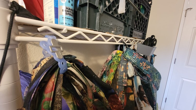 Wire racks can store all types of different items. Visors and hates hang from a a wire rack that is housing other gear. Photo by Joseph Gonzalez.