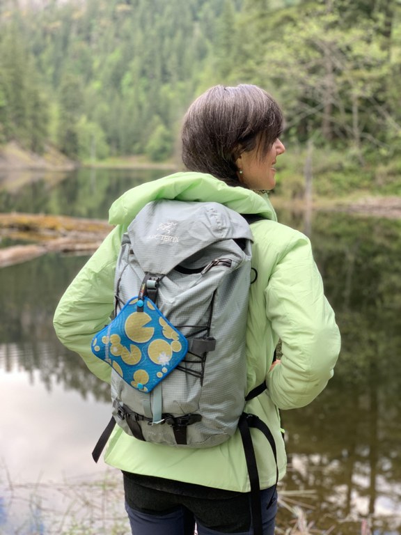 Kula Cloth A decorative Kula Cloth hangs on the back of a backpack