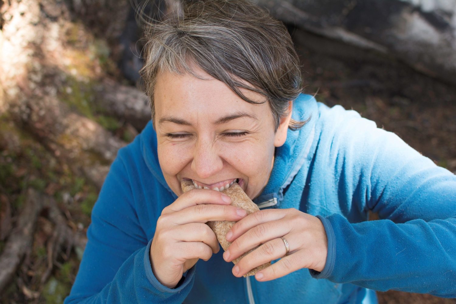 Eating a tortilla. Photo by Erika Haugen-Goodman. Hiker eating a tortilla. Photo by Erika Haugen-Goodman.