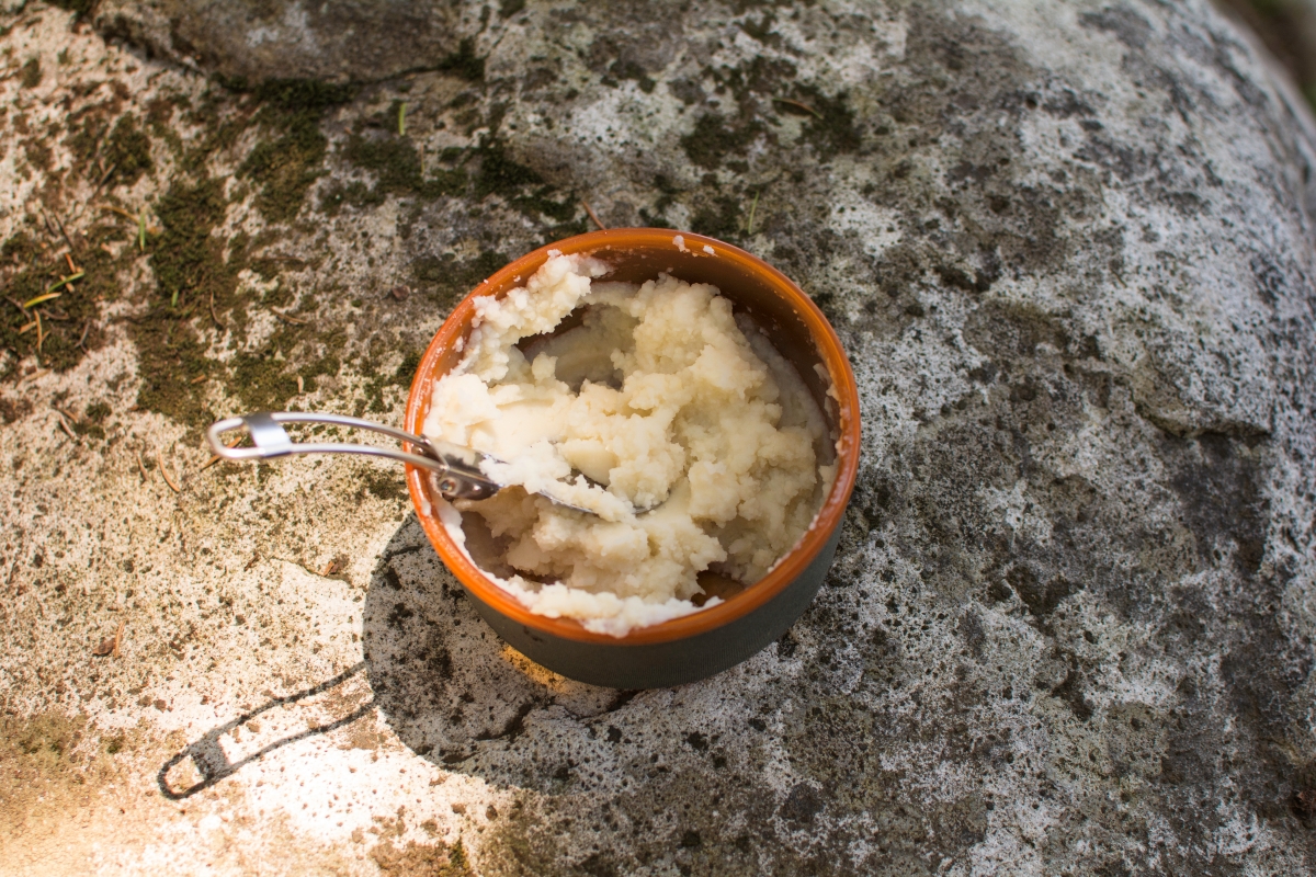 Mashed potatoes. Photo by Erika Haugen-Goodman. Mashed potatoes made from potato flakes in a bowl outside. Photo by Erika Haugen-Goodman.
