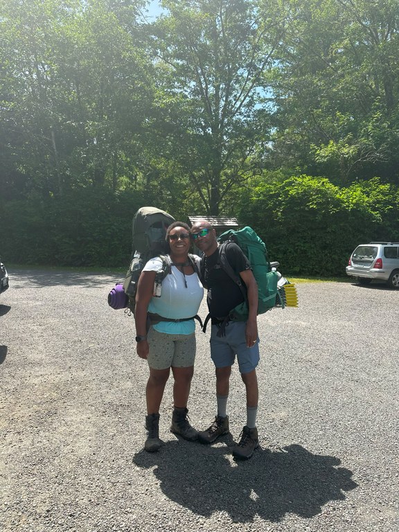 Angelic smiling at the camera with her dad on his first backpacking trip on the Ozette Triangle on the Olympic Coast. Photo by Angelic Friday.