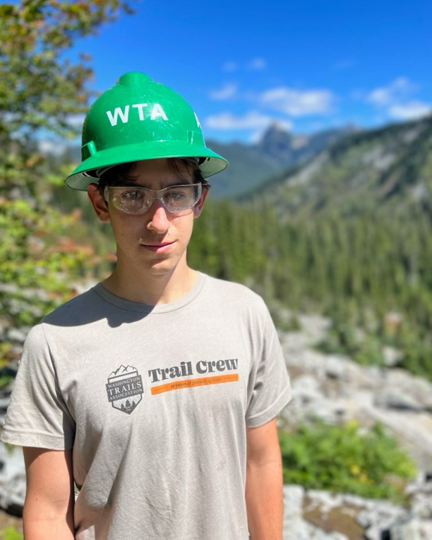 Asher Levy relishes being active in nature on BCRTs. Photo by Tobias Levy A volunteer greenhat stands on trail.