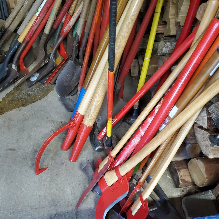 freshly painted tools photo by mj sampsan red freshly painted trail malignance tools with wooden handles