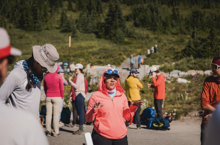 Rachel and other climbers stand at the trailhead in anticipation for their upcoming climb.