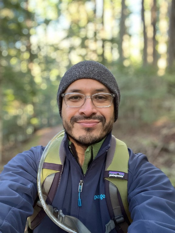 Matt Martinez. By Matt Martinez. Matt Martinez takes a selfie with a forested backdrop. He's wearing a beanie, backpack, and a jacket.