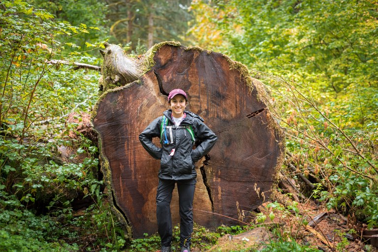 Angelina posing by fallen tree. Photo by Nick Martinson.
