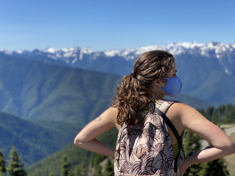 A hiker stands at an overlook on Hurricane Ridge