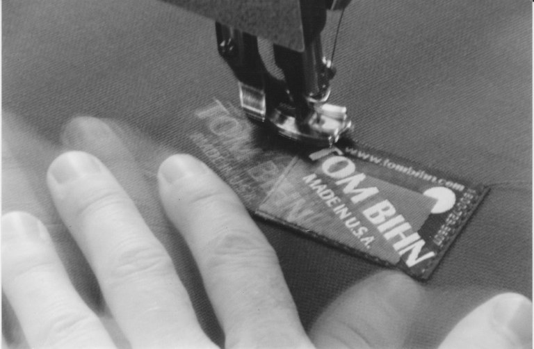 SC Store sewing the label.jpg