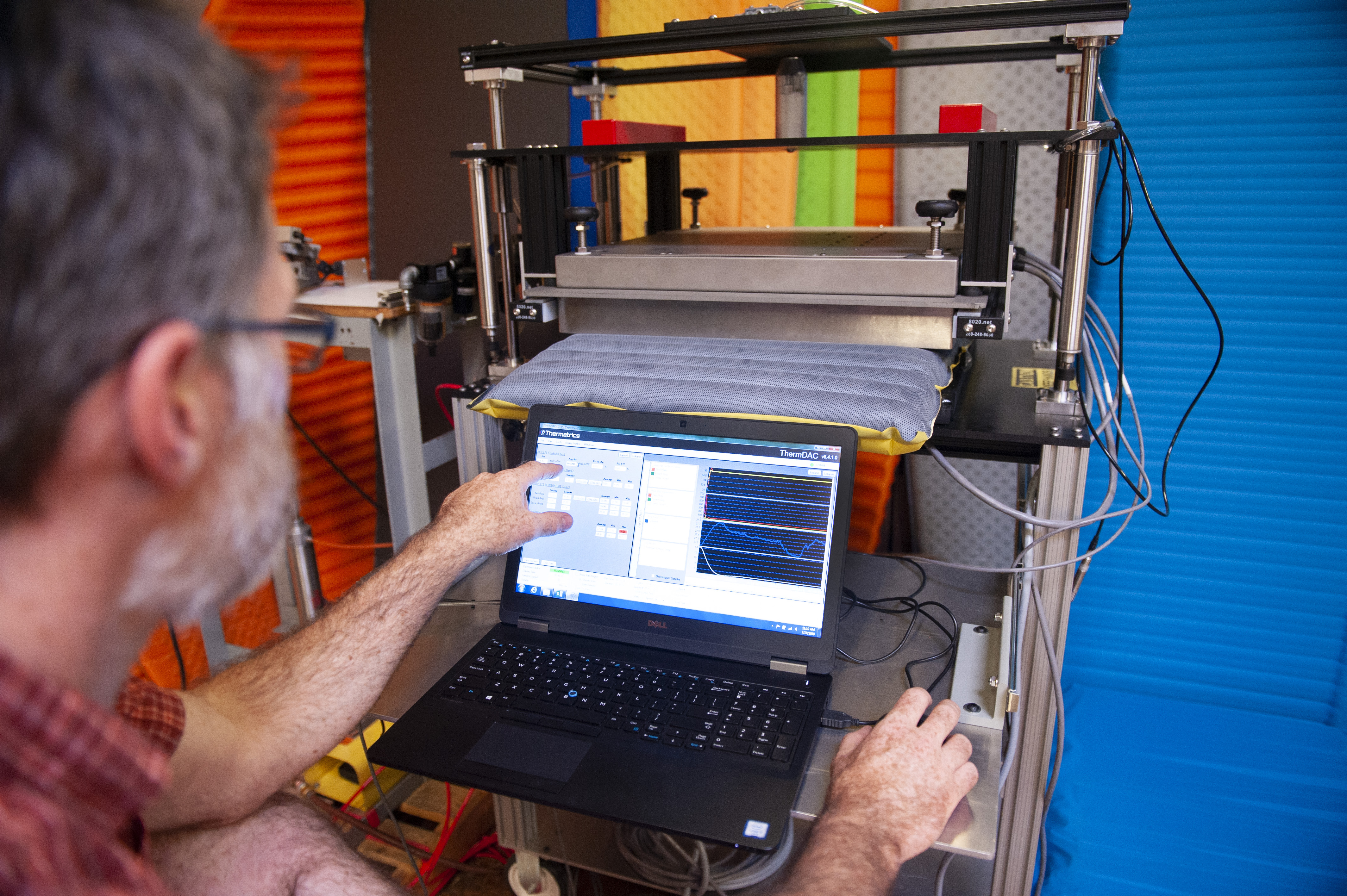 Thermarest factory A Thermarest employee works on a laptop while testing new sleeping mats.