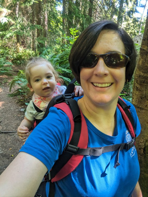 Foulweather Nature Preserve A hiker wears a toddler on her back in a backpack.