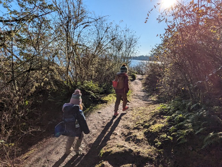 Kids on trail Two young kids run down a trail.