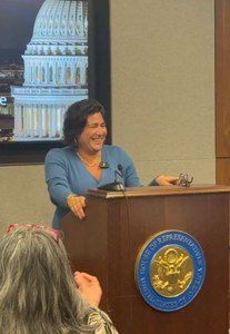 Congresswoman Randall stands at a podium and gives a speech in Washington D.C.