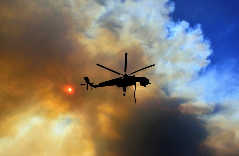 helicopter over smoke