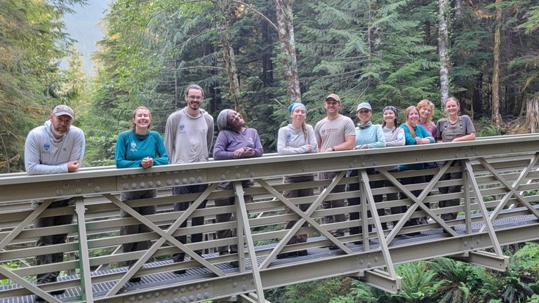 Some projects — like a hitch to Boulder Lake in August — can accommodate two crews instead of one. Photo by Joseph Gonzalez A pair of LTF crews pose on a bridge.