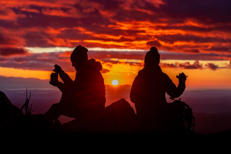2nd Place Hikers in Action silhouettes of hikers eating on mountain