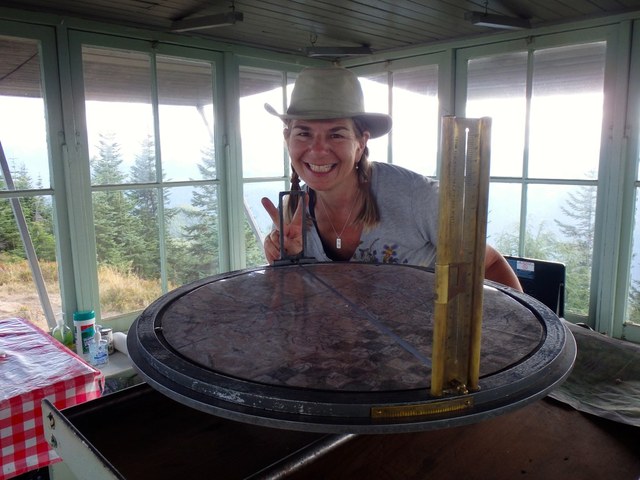 Checking out the fire spotting equipment at the lookout. Photo by Austin Smith.