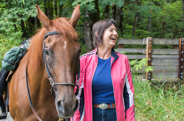 Kathy laughs during a walk at Taylor Mountain. Photo by Erik Haugen-Goodman. 