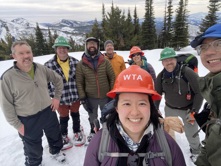 A group of WTA volunteers in the snow.
