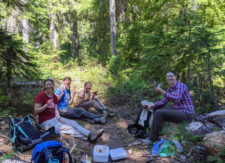Three BCRT volunteers and a crew member stop to enjoy some ice cream on the Pete Lake BCRT. Photo by Albert Nakano.