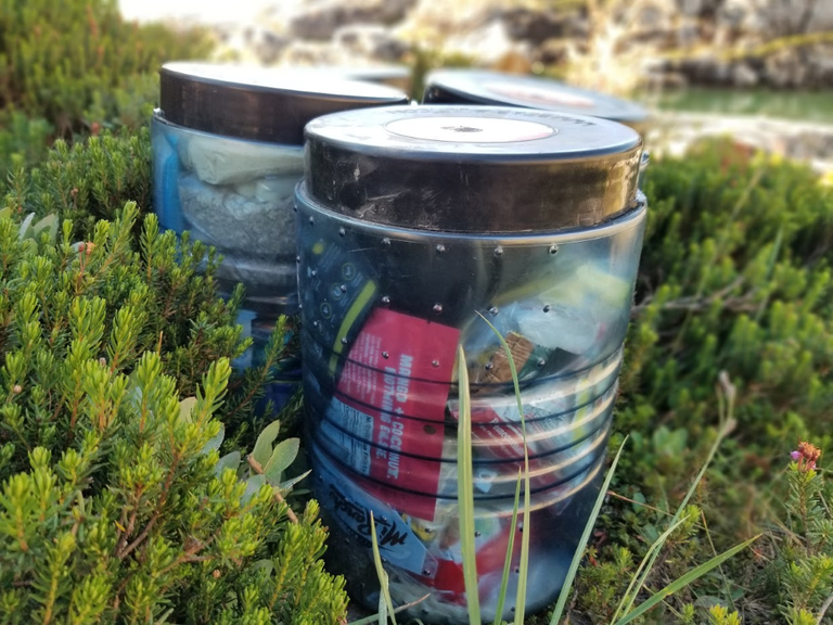 Bear canisters on the ground. Photo by Joseph Gonzalez.