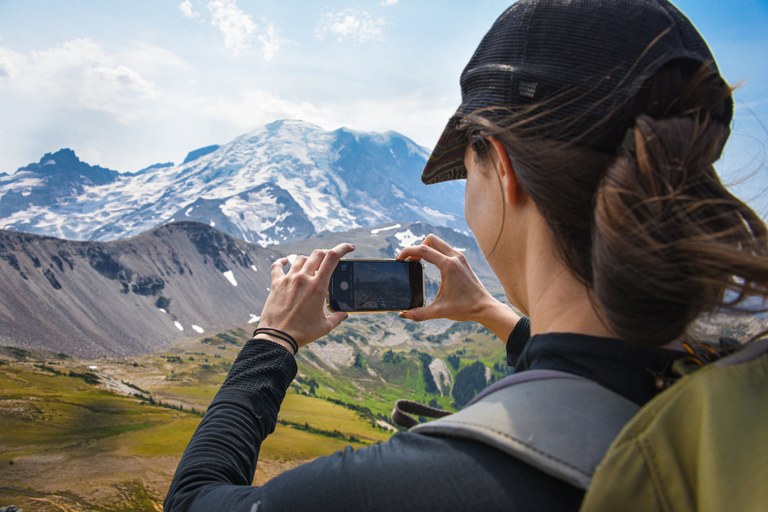 A photo of a hiker taking a picture. Photo by Ben Beehner.