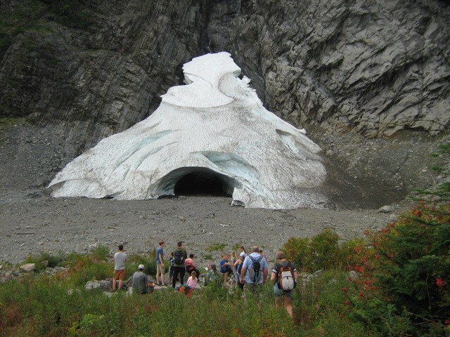 Many hikers a safe distance away from the opening to the Big Four Ice Caves. Photo by LongWalk.