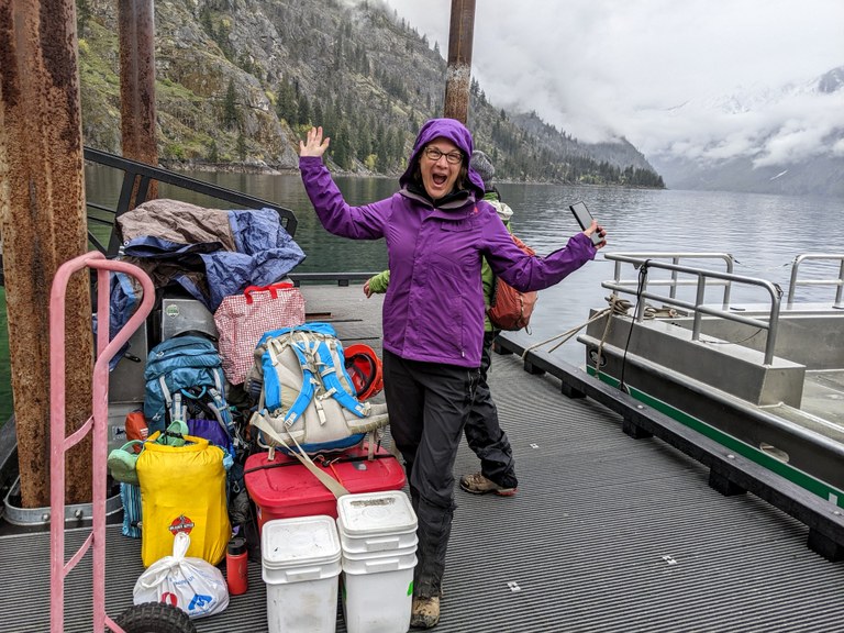 A photo of a volunteer excited to be heading out on a volunteer vacation at Chelan Lakeshore. Photo by Bob Zimmerman.