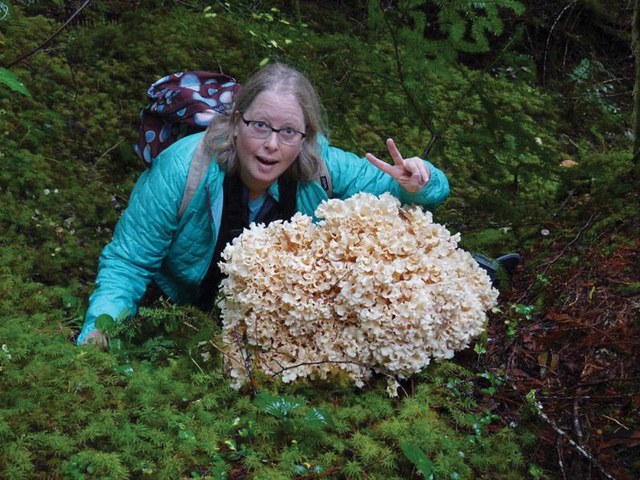 Kim posing next to a pretty impressive fungus. Photo by Gwen Tollefson