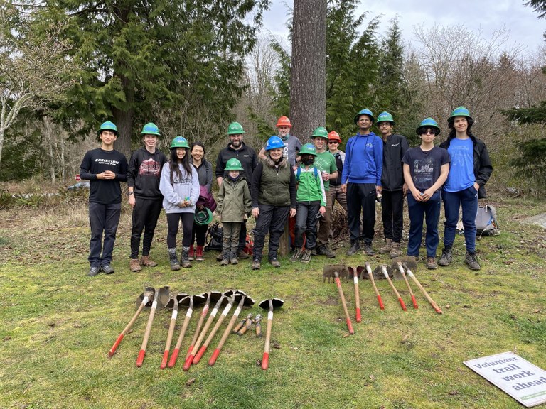 Youth day work party crew group photo with tools in the foreground. Photo by Micki Kedzierski.