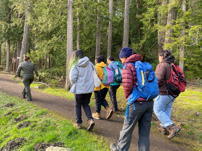 ELP hiking. Photo by MJ Sampang. ELP hiking on a trail with a Washington State Parks staff member. Photo by MJ Sampang.