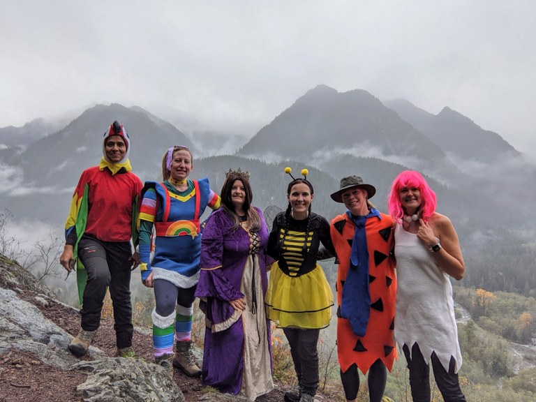 A group of hikers in Halloween costumes at Garfield Ledges on a foggy day. Photo by WalkieTalkie.