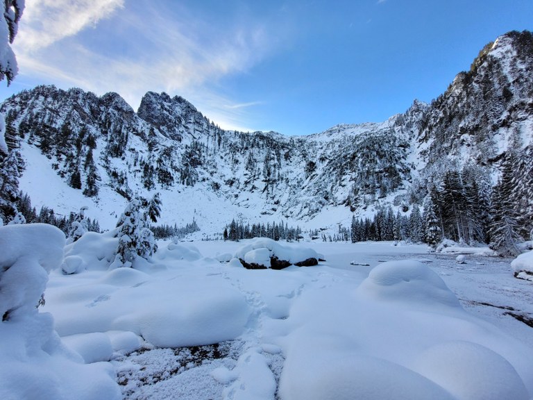 A snowy lake. Photo by MeLuckyTarns. A heavy layer of snow on Heather Lake. Photo by MeLuckyTarns.