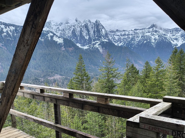 The view of snow-capped peaks and trees from Heybrook Lookout. Photo by trip reporter KatyCat.