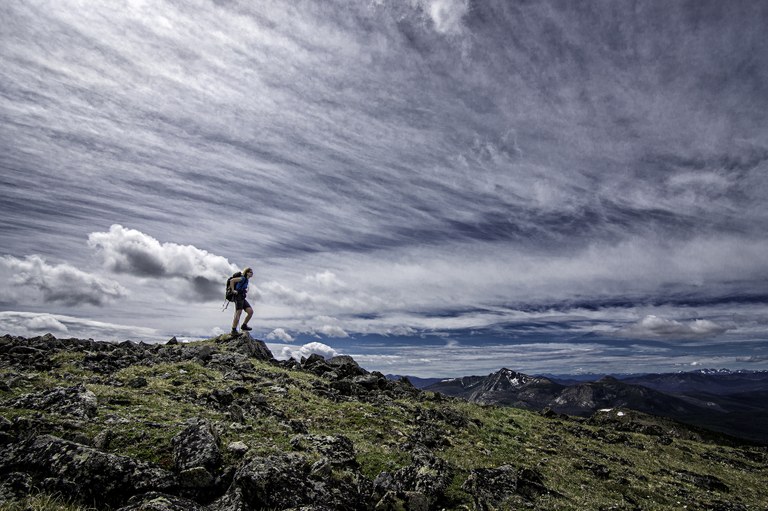 Hiker along an open ridge at Horseshoe Basin. 