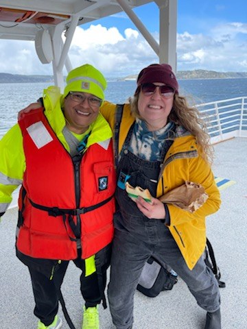 Two teachers smiling and enjoying time out on water on Doolin-Rodgers.