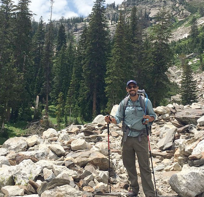 welcome jaime Jaime Loucky with backpack enjoying the outdoors.