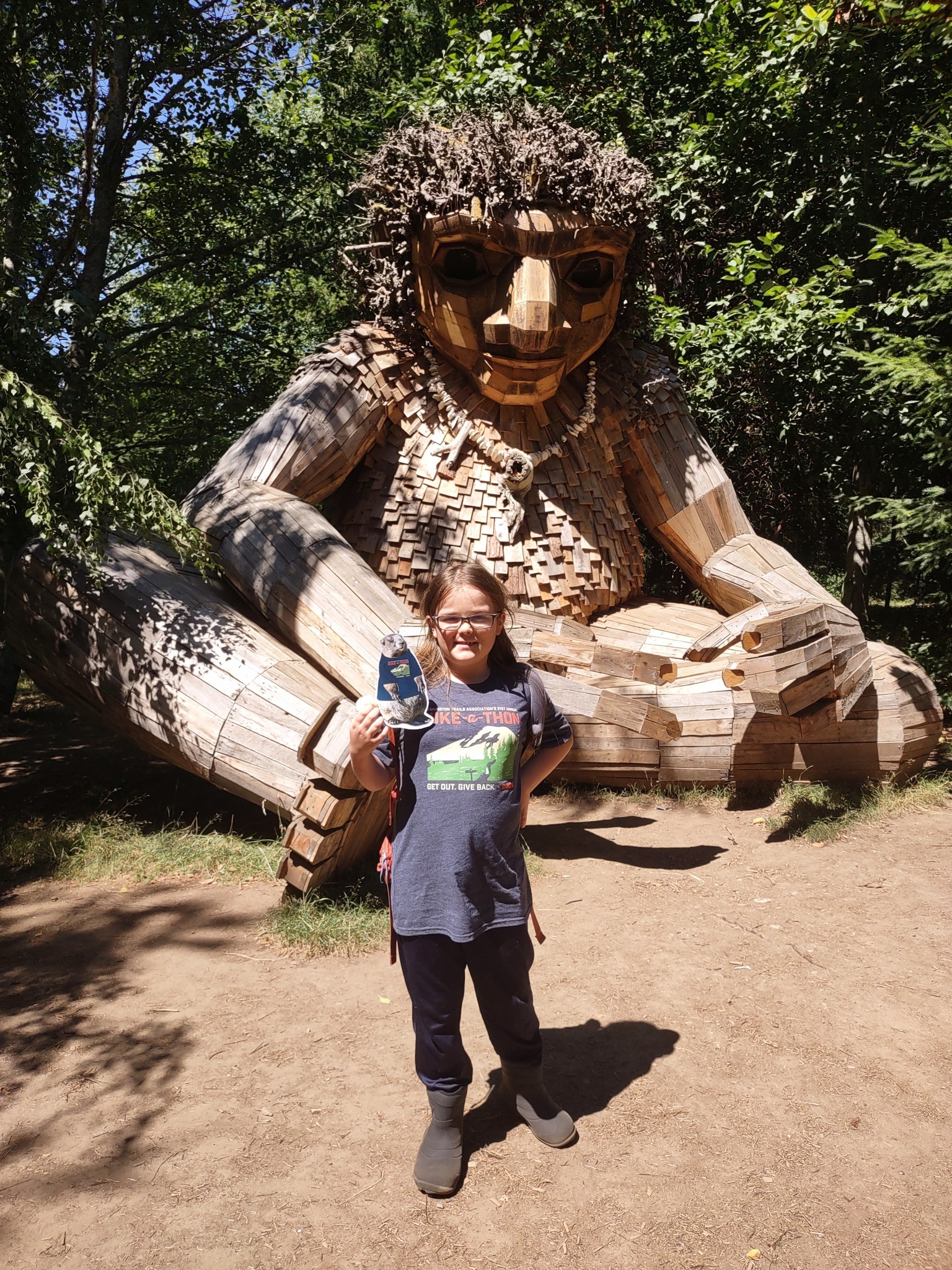 Young Hike-a-Thoner with a cutout of Miles the Marmot in front of the Northwest Troll on Bainbridge Island. Photo by Jennifer Bradwin.