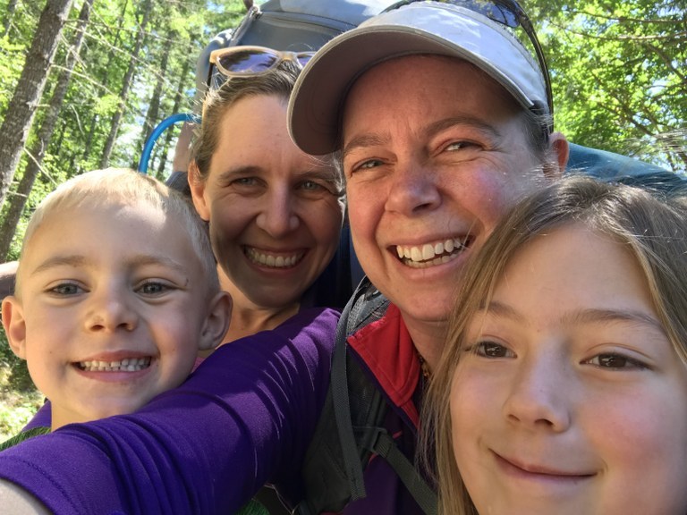 A selfie with two women and two kids.