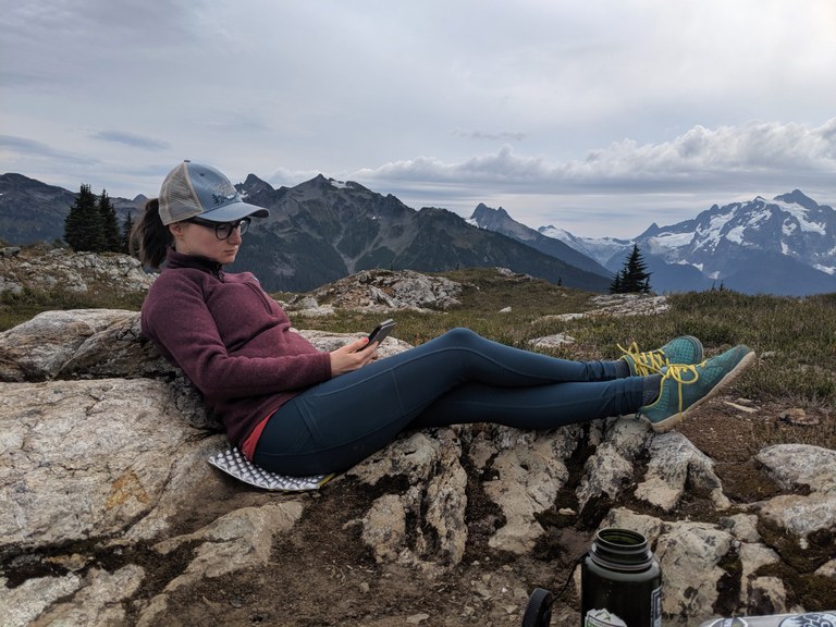 WTA staffer Laura Norsen reads on a hike.