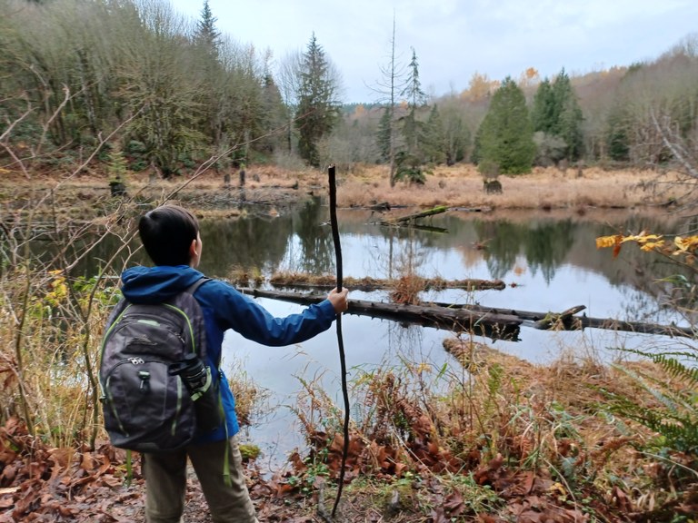 Ramfamhikes Lord Hill A boy looks into a pond.