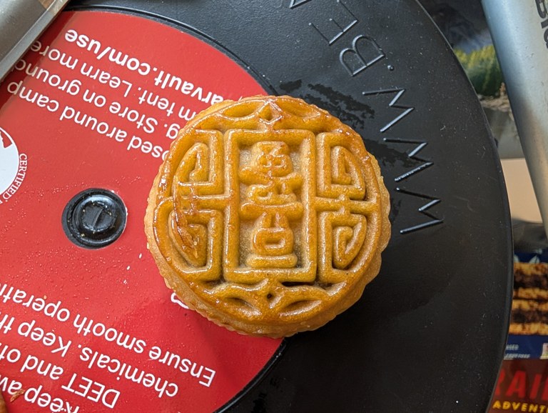 A mooncake up close on a bear canister, showing off the intricate design on it. Photo by Tiffany Chou. 