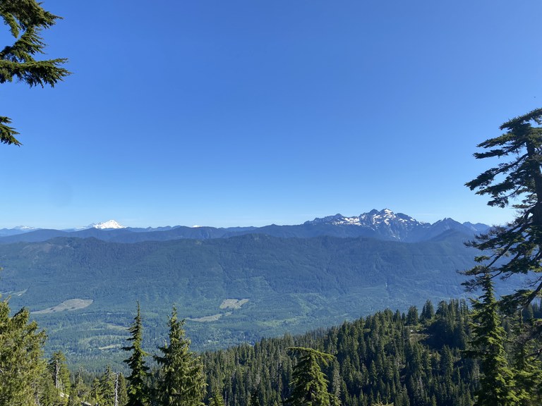 Views of mountains including Mount Baker from the Mount Pilchuck trail. Photo by Chawpaway.