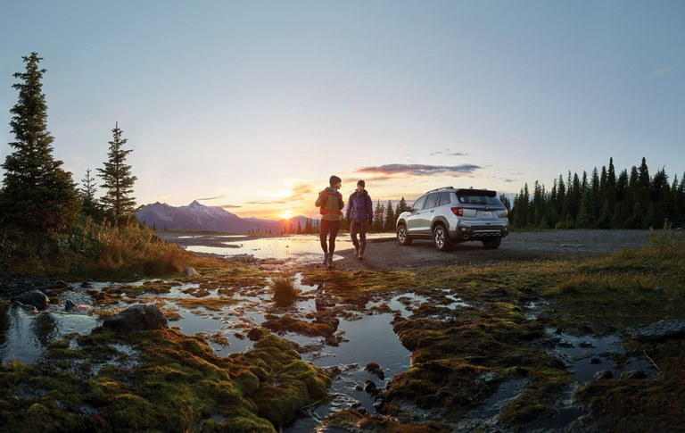 Photo by Western Washington Honda Dealers. Photo Two hikers next to a Honda vehicle. Photo by Western Washington Honda Dealers.