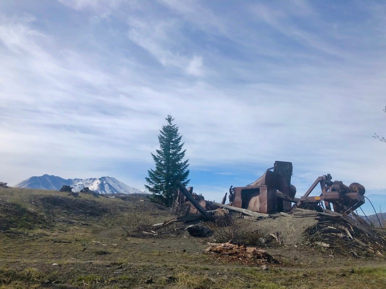 Old mining equipment and Mount St. Helens from the South Coldwater Trail. Photo by VentureBold.