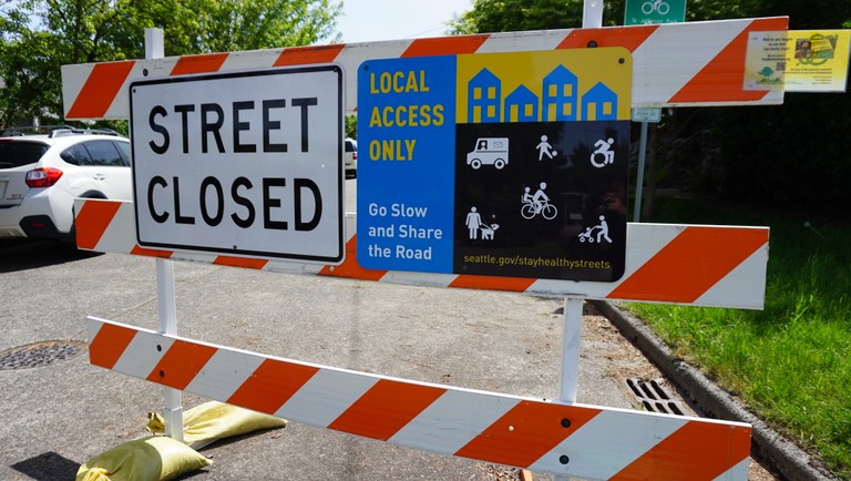 A sign that says street is closed except to cyclists, pedestrians, people in wheelchairs. 